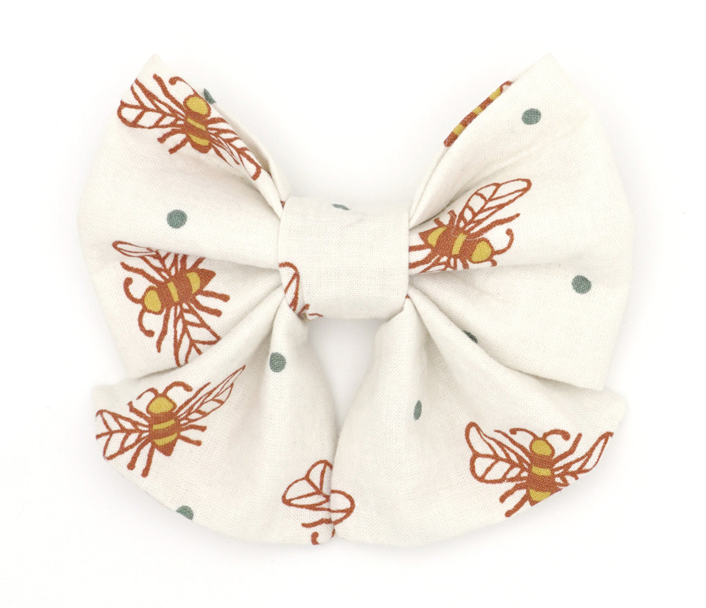 Handmade cotton bow tie with tails for dogs (or other pets). Elastic straps on back with snaps make it easy to add to collar, harness, or leash. Cream background with orange and yellow bees, and grey/green polka dots.