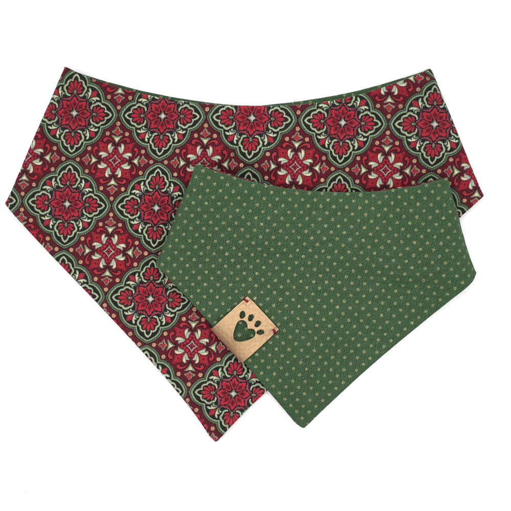 Reversible bandana for dogs. Snaps on back make it adjustable. One side is Red. green, gold and black ornamental design and the other side has a Green background with gold metallic polka dots. Gold tag with heart paw cut out on side.