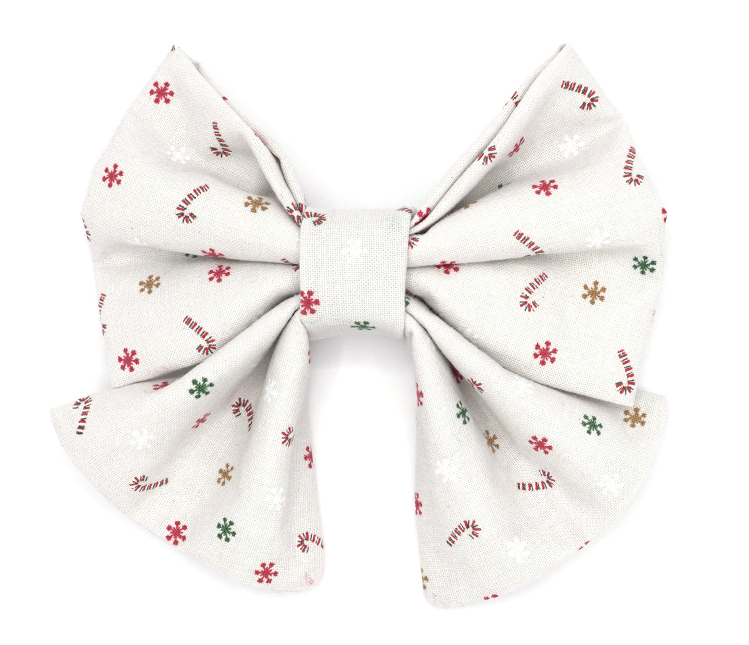 Handmade cotton bow tie with tails for dogs (or other pets). Elastic straps on back with snaps make it easy to add to collar, harness, or leash. Light grey (almost white) background with red/white candy canes, and red, green, gold and white snowflakes.