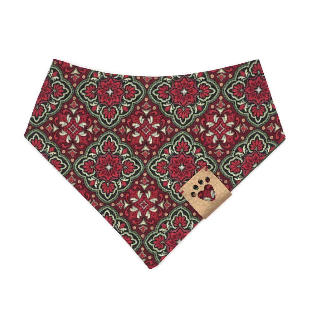 Reversible bandana for dogs. Snaps on back make it adjustable. One side is Red. green, gold and black ornamental design and the other side has a Green background with gold metallic polka dots. Gold tag with heart paw cut out on side.