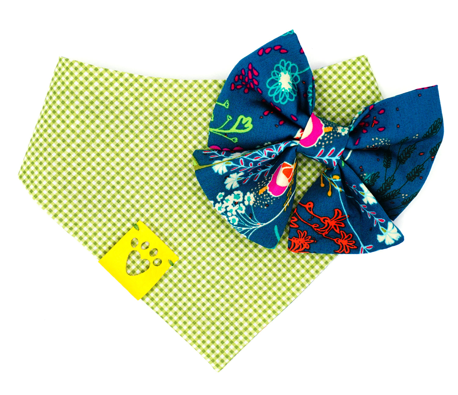Handmade cotton bow tie with tails for dogs (or other pets). Elastic straps on back with snaps make it easy to add to collar, harness, or leash. Dark green/teal background with magenta, dark purple, lime green, white, light blue, goldenrod, and orange flowers.
