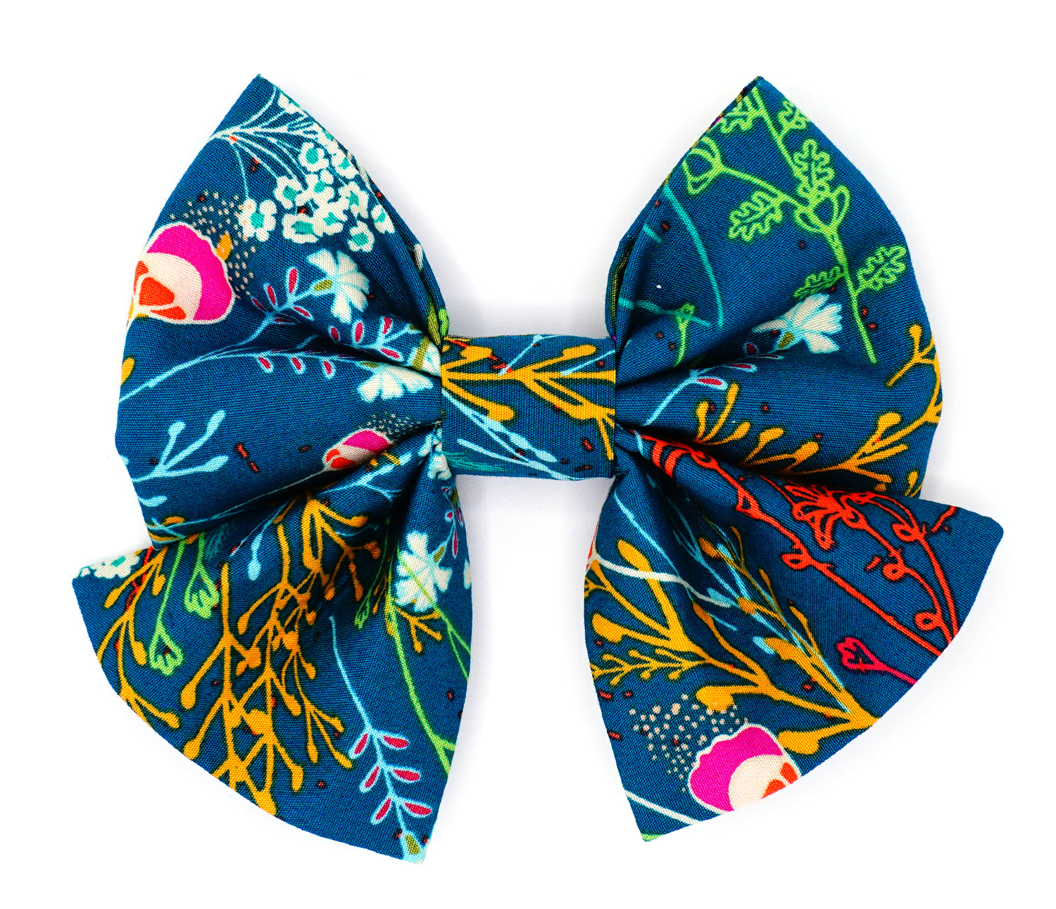 Handmade cotton bow tie with tails for dogs (or other pets). Elastic straps on back with snaps make it easy to add to collar, harness, or leash. Dark green/teal background with magenta, dark purple, lime green, white, light blue, goldenrod, and orange flowers.