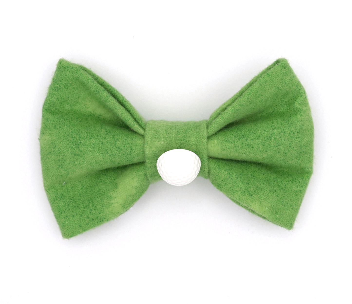 Handmade polyester bow tie for dogs (or other pets). Elastic straps on back with snaps make it easy to add to collar, harness, or leash. Bright green print that looks like a golf green with golf ball button in center of bow.