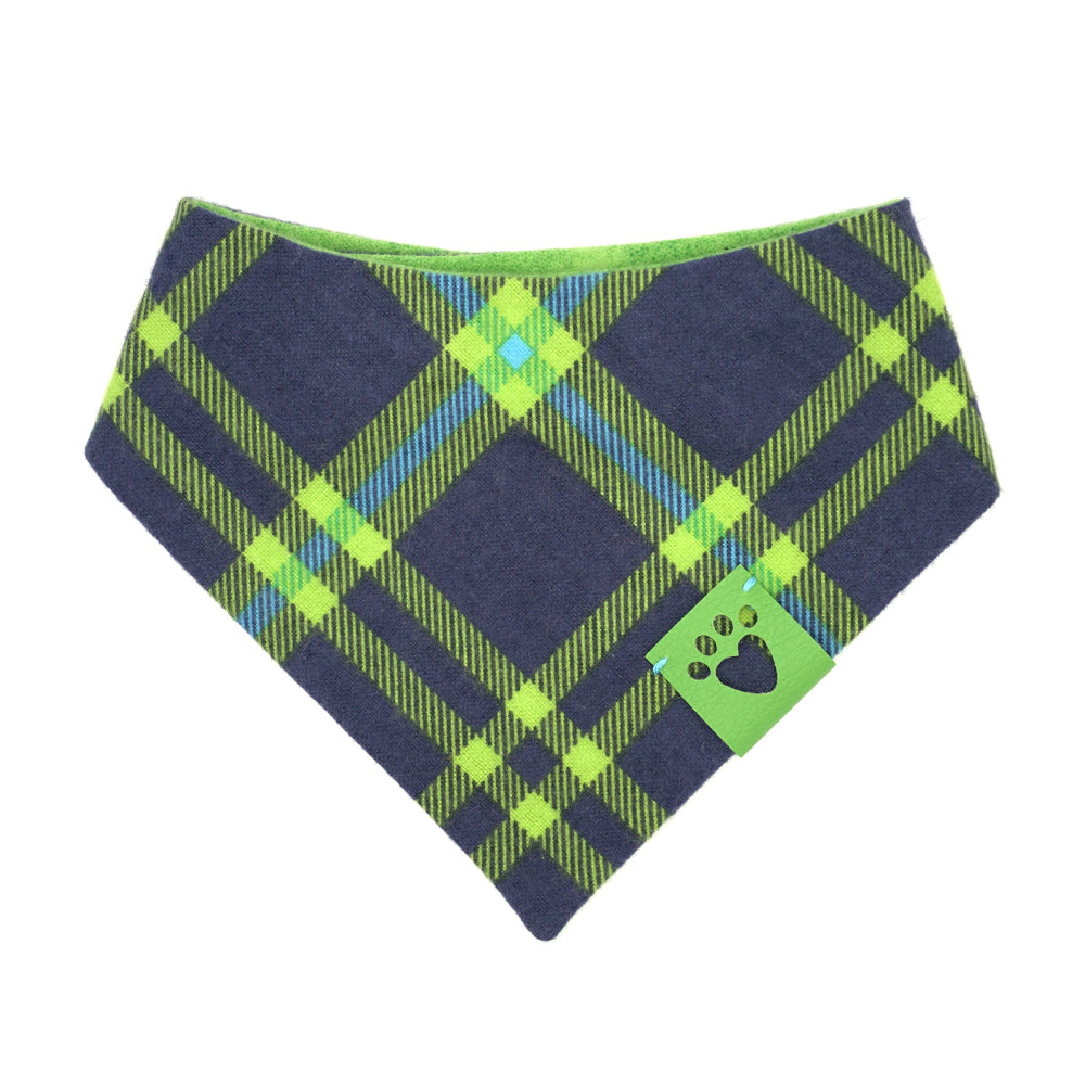 Reversible bandana for dogs. Snaps on back make it adjustable. One side is Bright blue, navy blue and bright green plaid and the other side has a Bright green print that looks like a golf green. Green tag with heart paw cut out on side.
