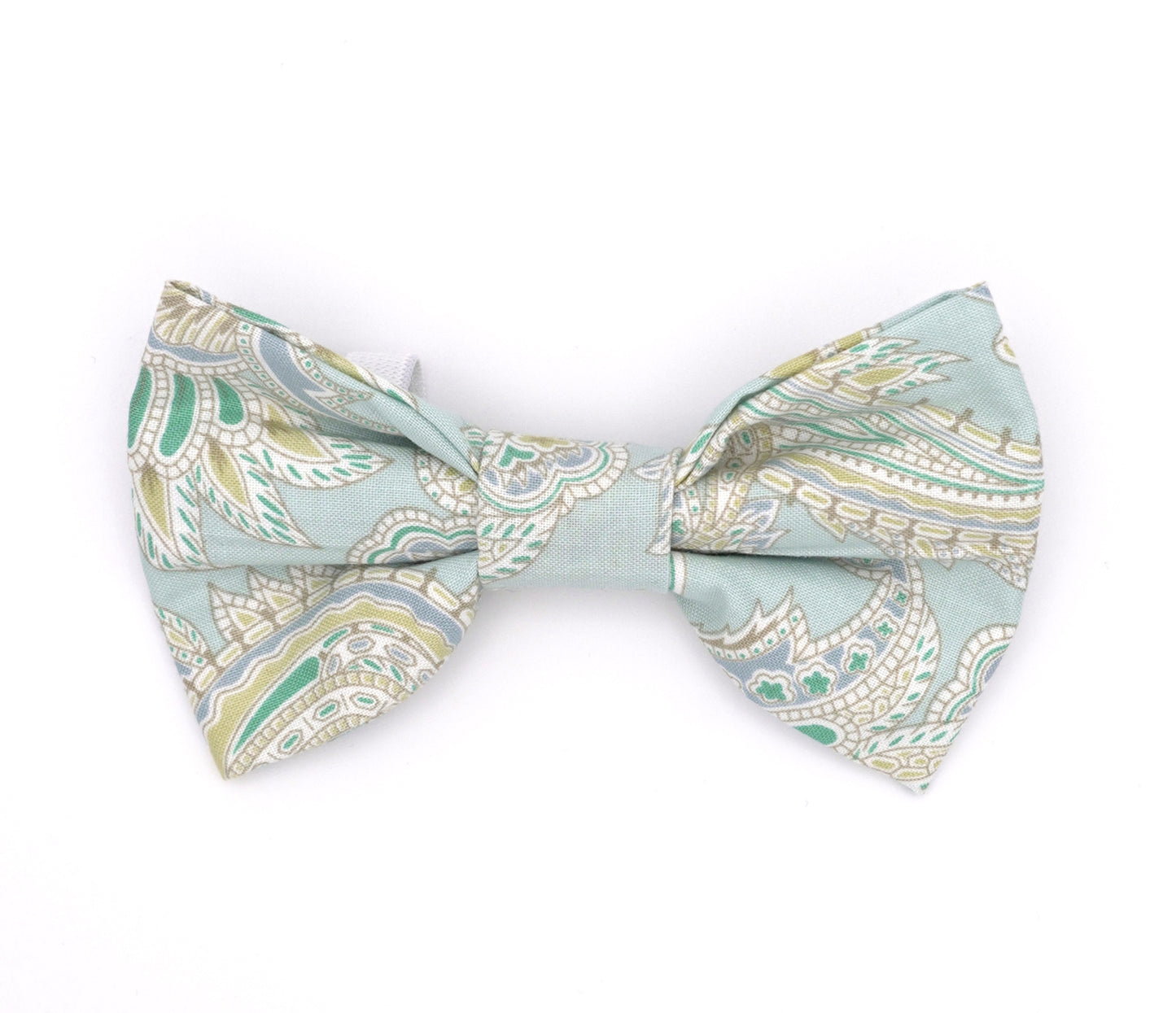 Handmade cotton bow tie for dogs (or other pets). Elastic straps on back with snaps make it easy to add to collar, harness, or leash. Light blue background with turquoise, apple-green, steel-blue, white and gold paisley pattern.