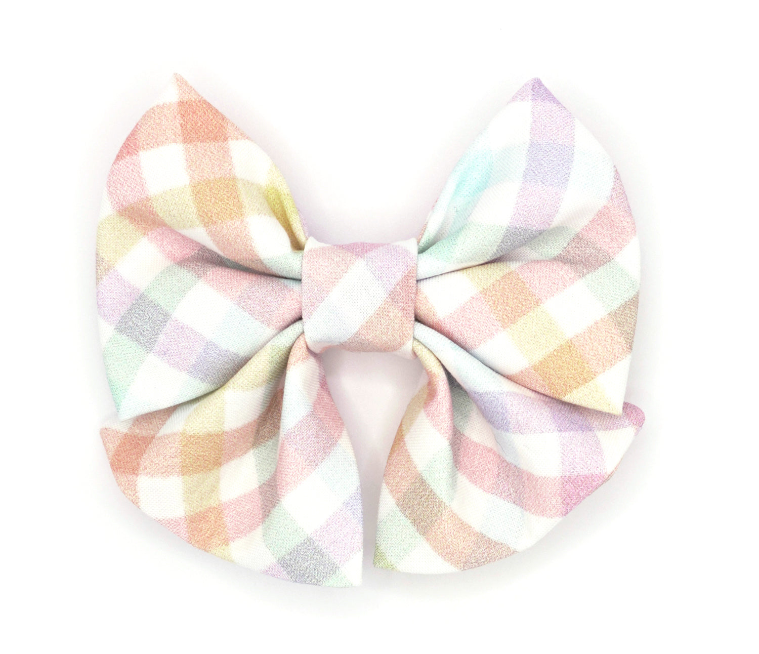 Handmade cotton bow tie with tails for dogs (or other pets). Elastic straps on back with snaps make it easy to add to collar, harness, or leash. White background with pastel rainbow plaid pattern.