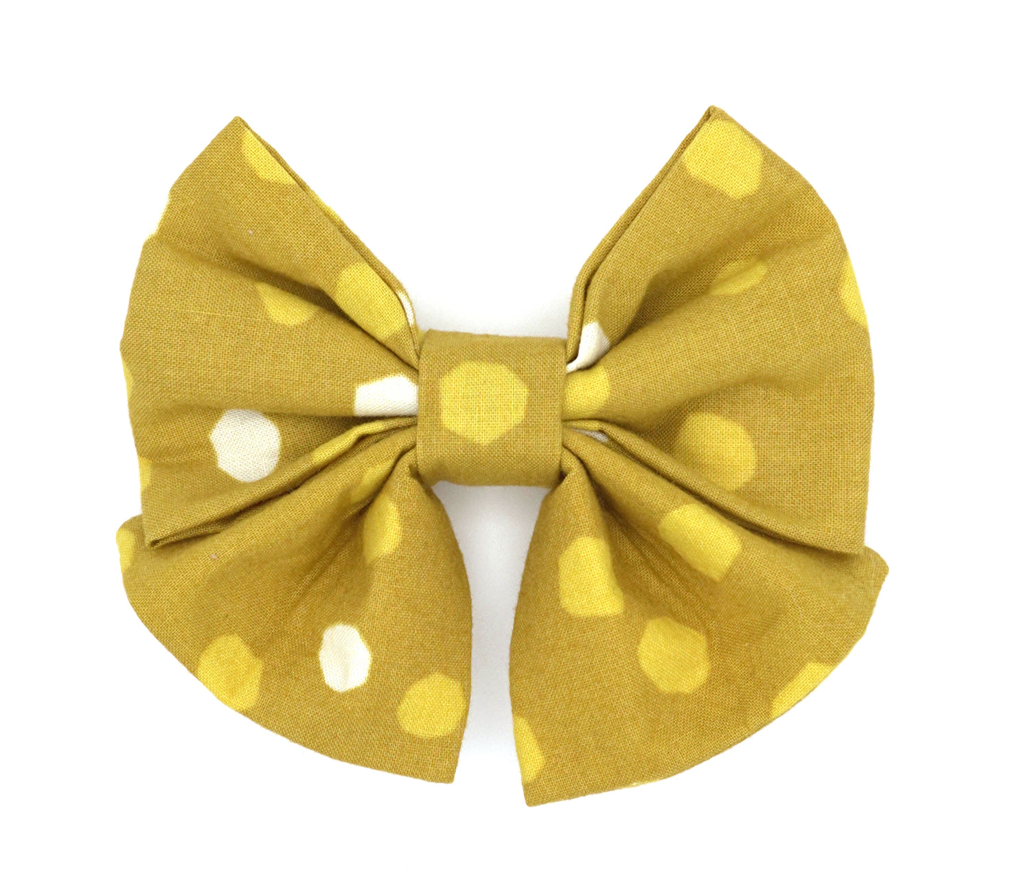 Handmade cotton bow tie with tails for dogs (or other pets). Elastic straps on back with snaps make it easy to add to collar, harness, or leash. Yellow background with bright yellow and cream irregular spots.
