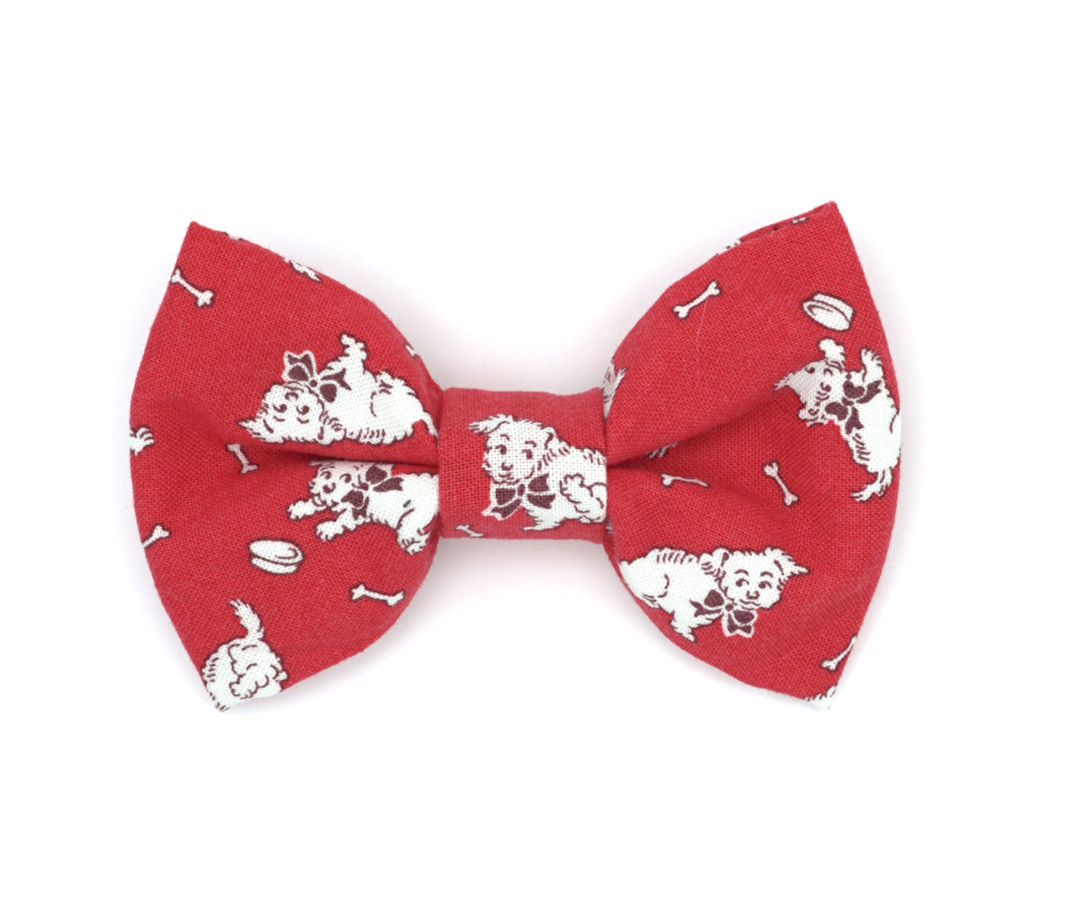 Handmade cotton bow tie for dogs (or other pets). Elastic straps on back with snaps make it easy to add to collar, harness, or leash. Bright red background with playful, white, vintage  puppies.