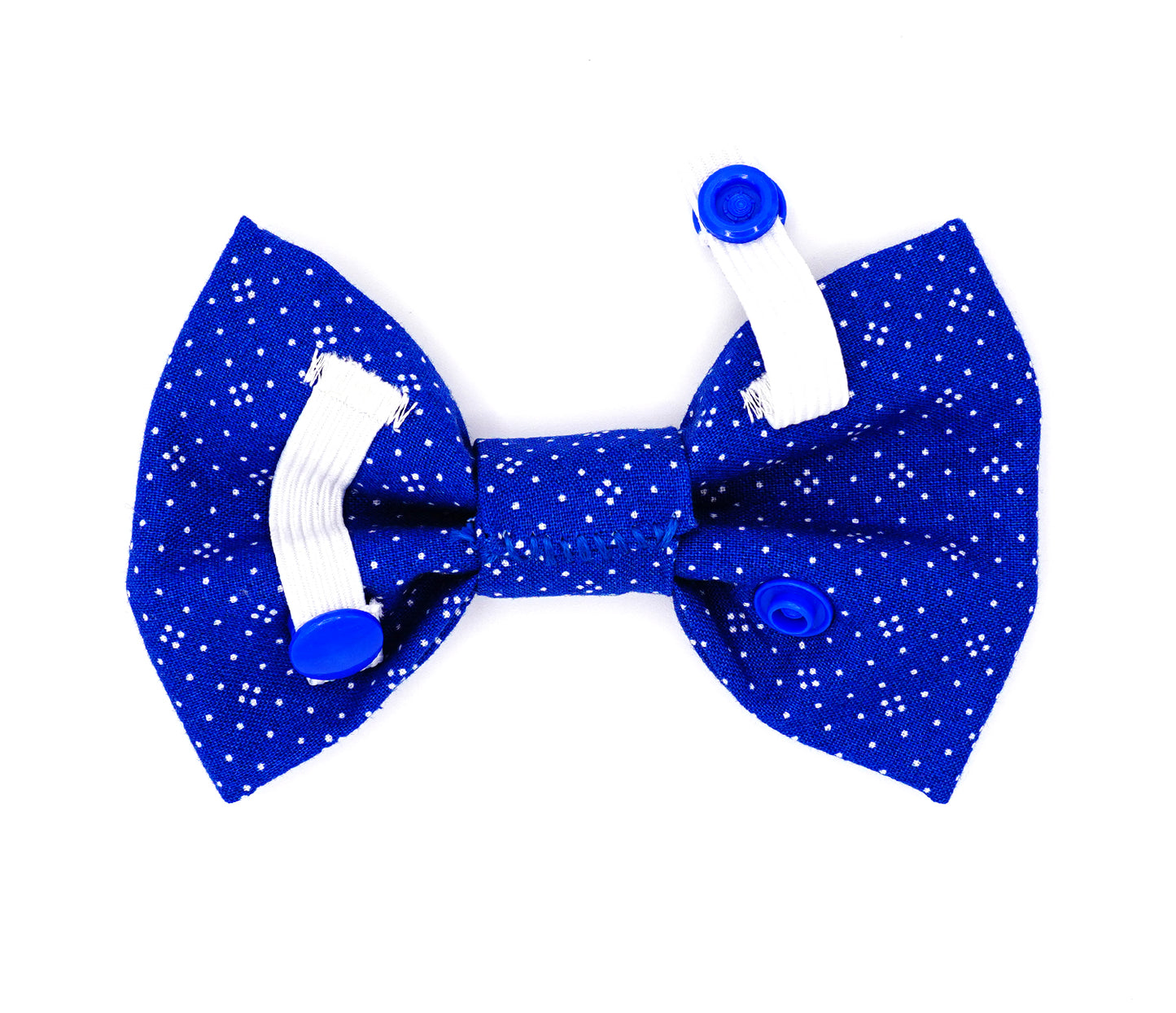 Handmade cotton bow tie for dogs (or other pets). Elastic straps on back with snaps make it easy to add to collar, harness, or leash. Medium blue background with a pattern of white dots.