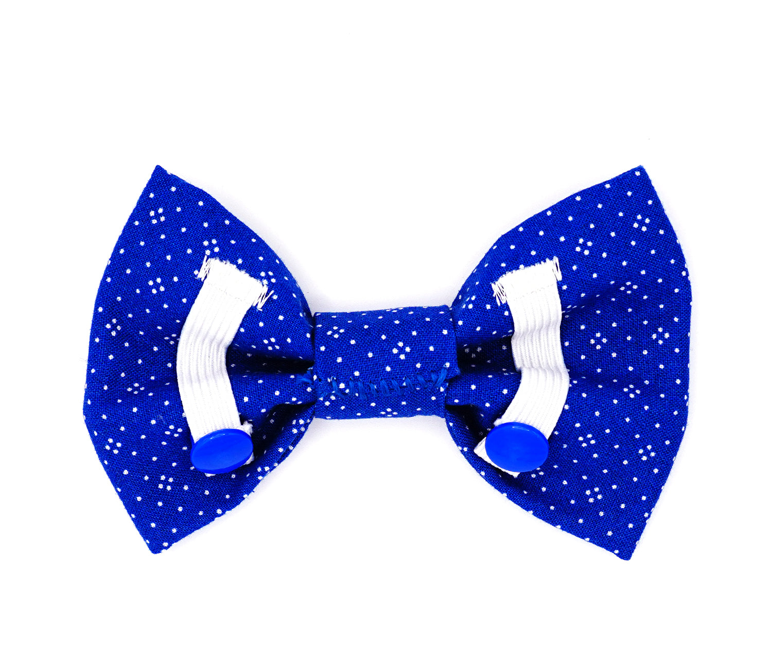 Handmade cotton bow tie for dogs (or other pets). Elastic straps on back with snaps make it easy to add to collar, harness, or leash. Medium blue background with a pattern of white dots.