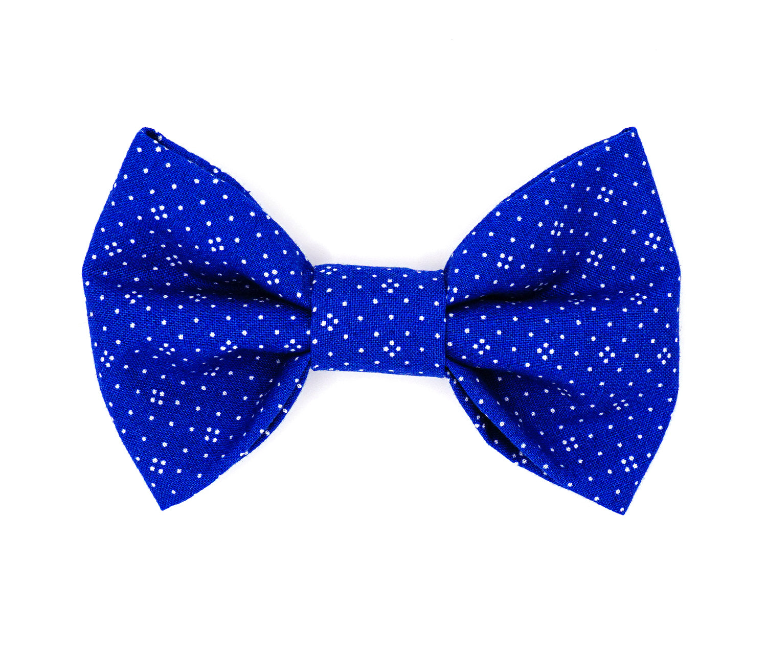 Handmade cotton bow tie for dogs (or other pets). Elastic straps on back with snaps make it easy to add to collar, harness, or leash. Medium blue background with a pattern of white dots.