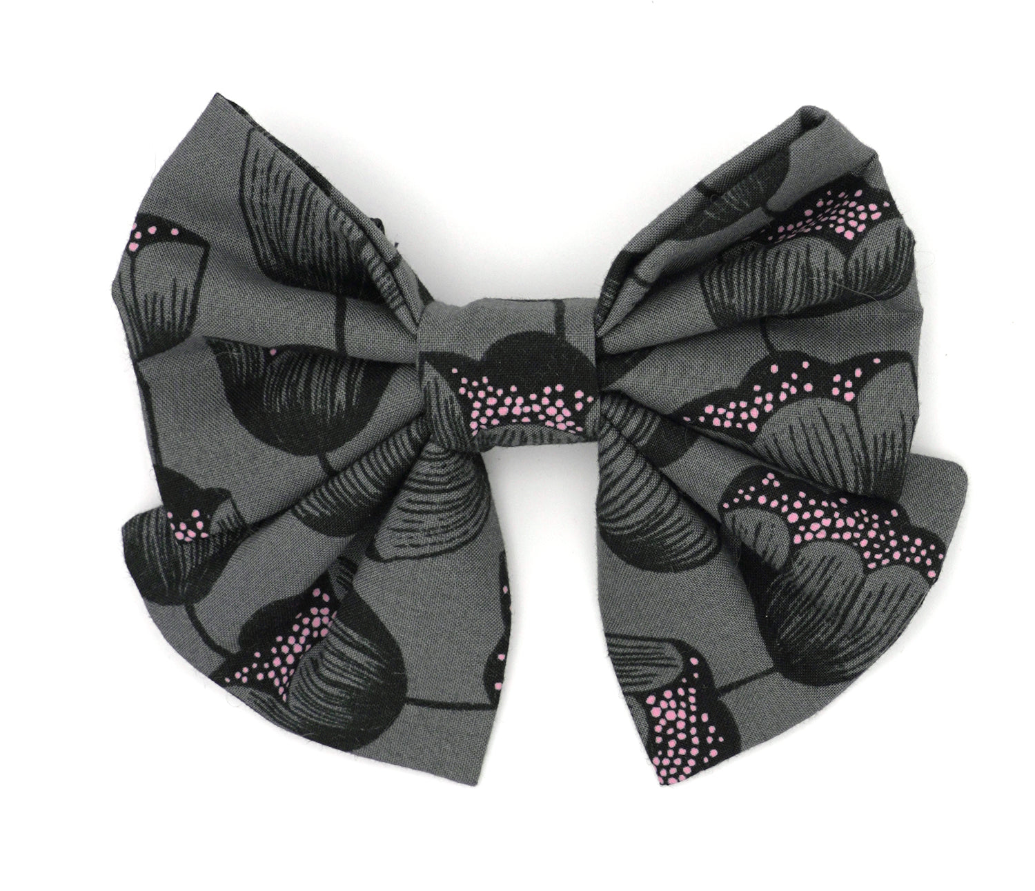 Handmade cotton bow tie with tails for dogs (or other pets). Elastic straps on back with snaps make it easy to add to collar, harness, or leash. Charcoal grey background with black and pink flowers.